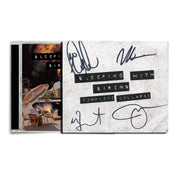 image of the signed cardboard cover over the CD cover for sleeping with sirens CD complete collapse